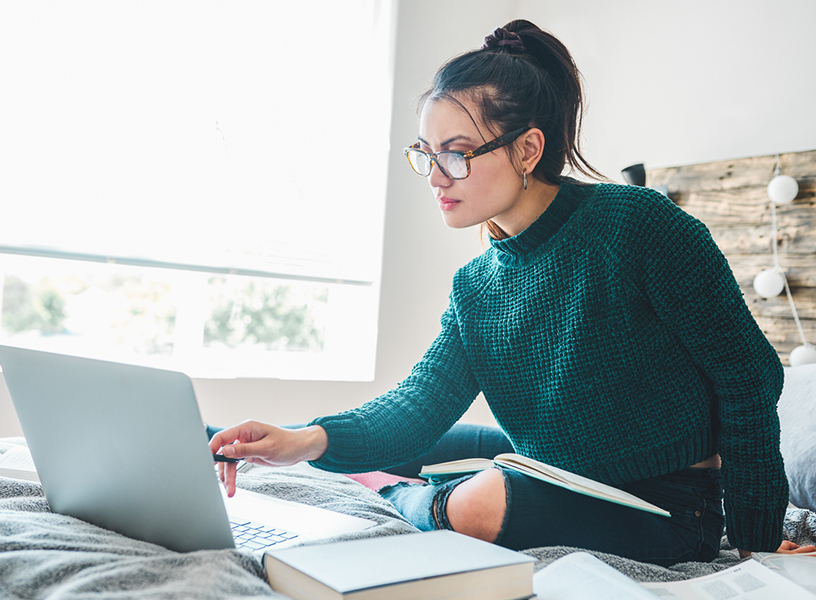 Young woman working on a laptop at home